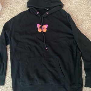 black hoodie with design on from and back